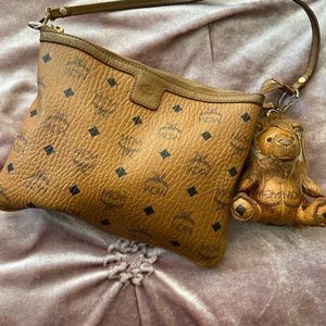 MCM pouch with lion charm
